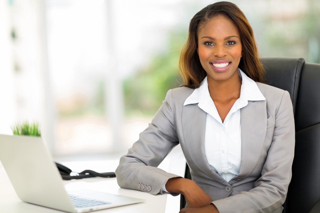 Young afro american businesswoman sitting in office - Office Services 101 Professional services business insurance